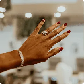 An elegant red manicure with sculpted nails, photographed in the salon